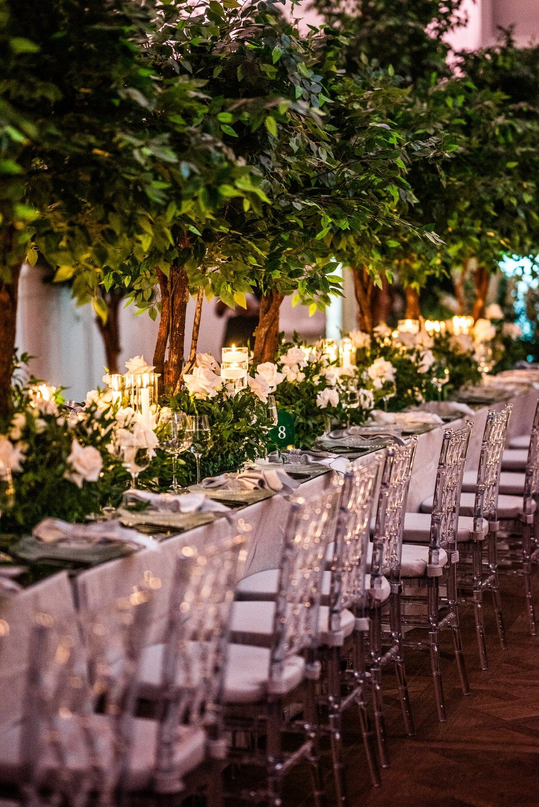 A long table under trees