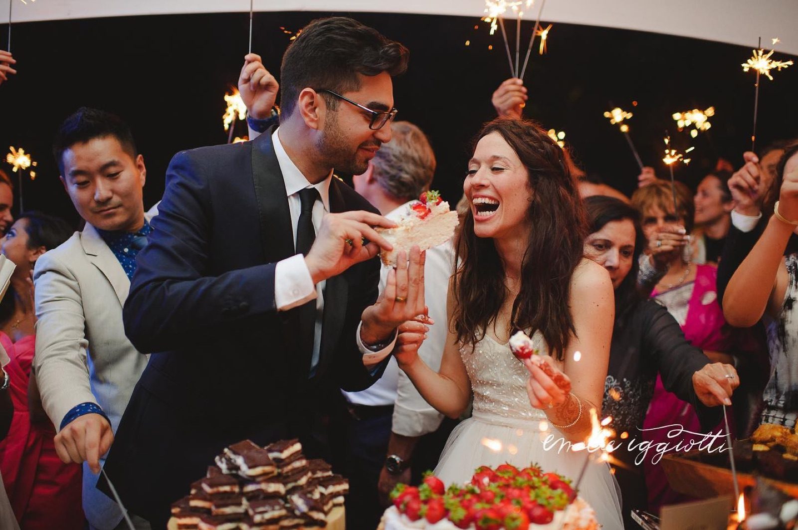 Guests laughing under sparklers