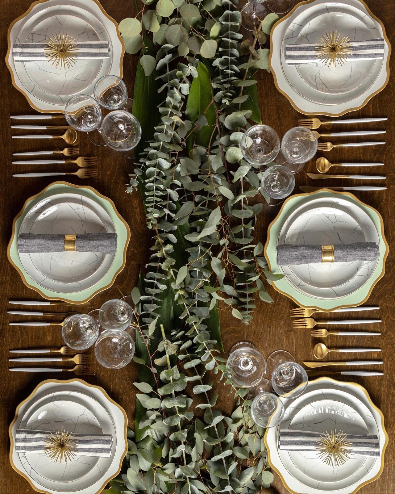 Eucalyptus and glassware place settings
