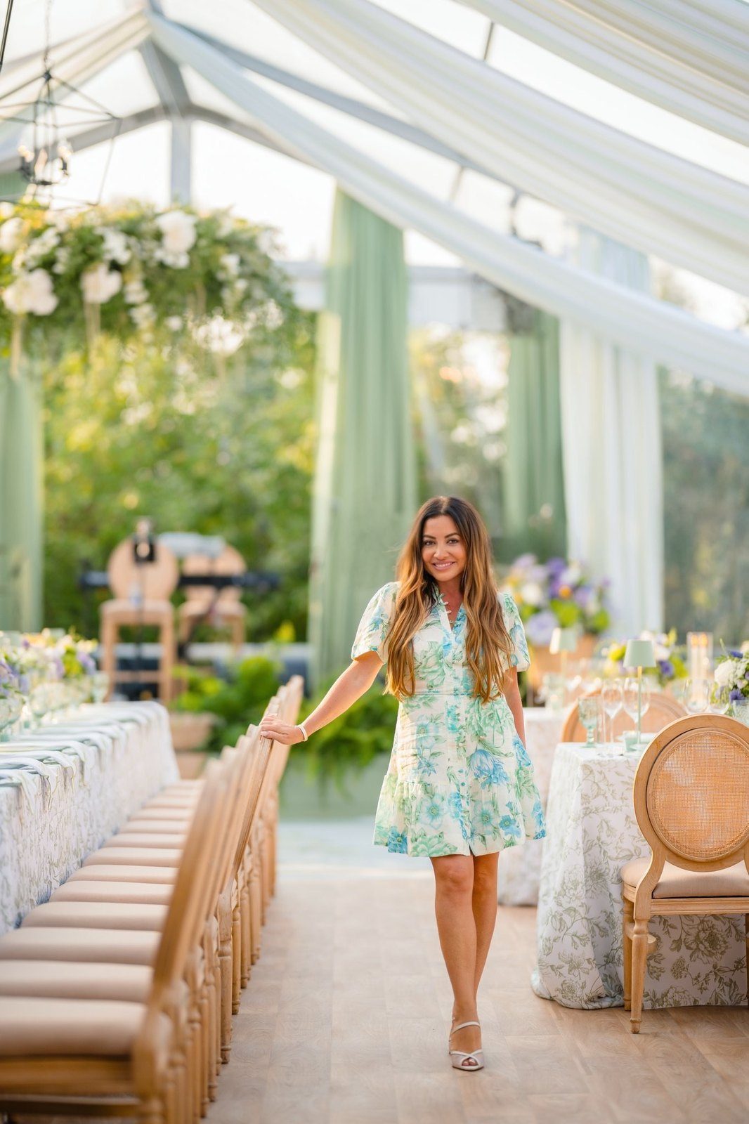 Maddy K in a garden pavilion set for lunch