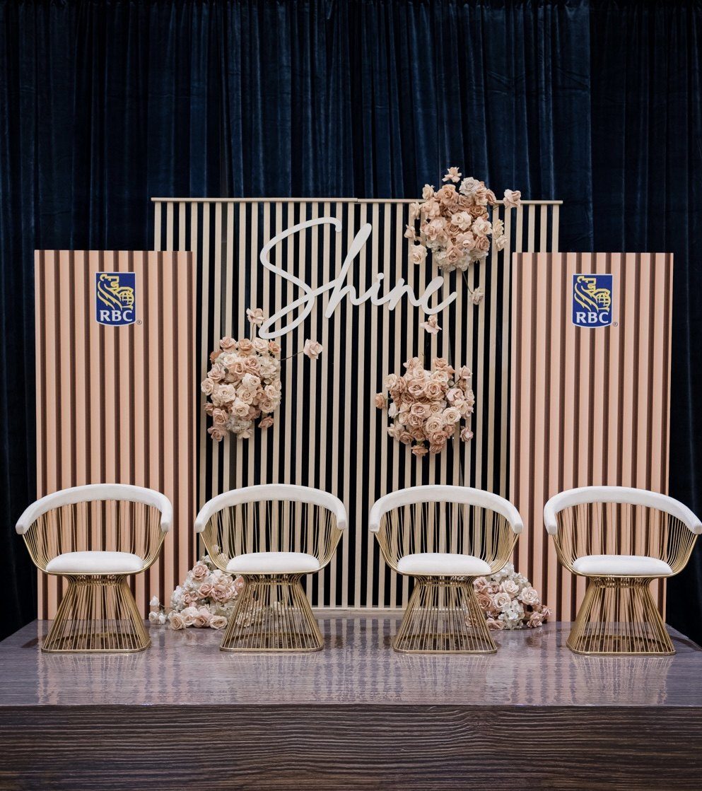Conference stage with a floral backdrop