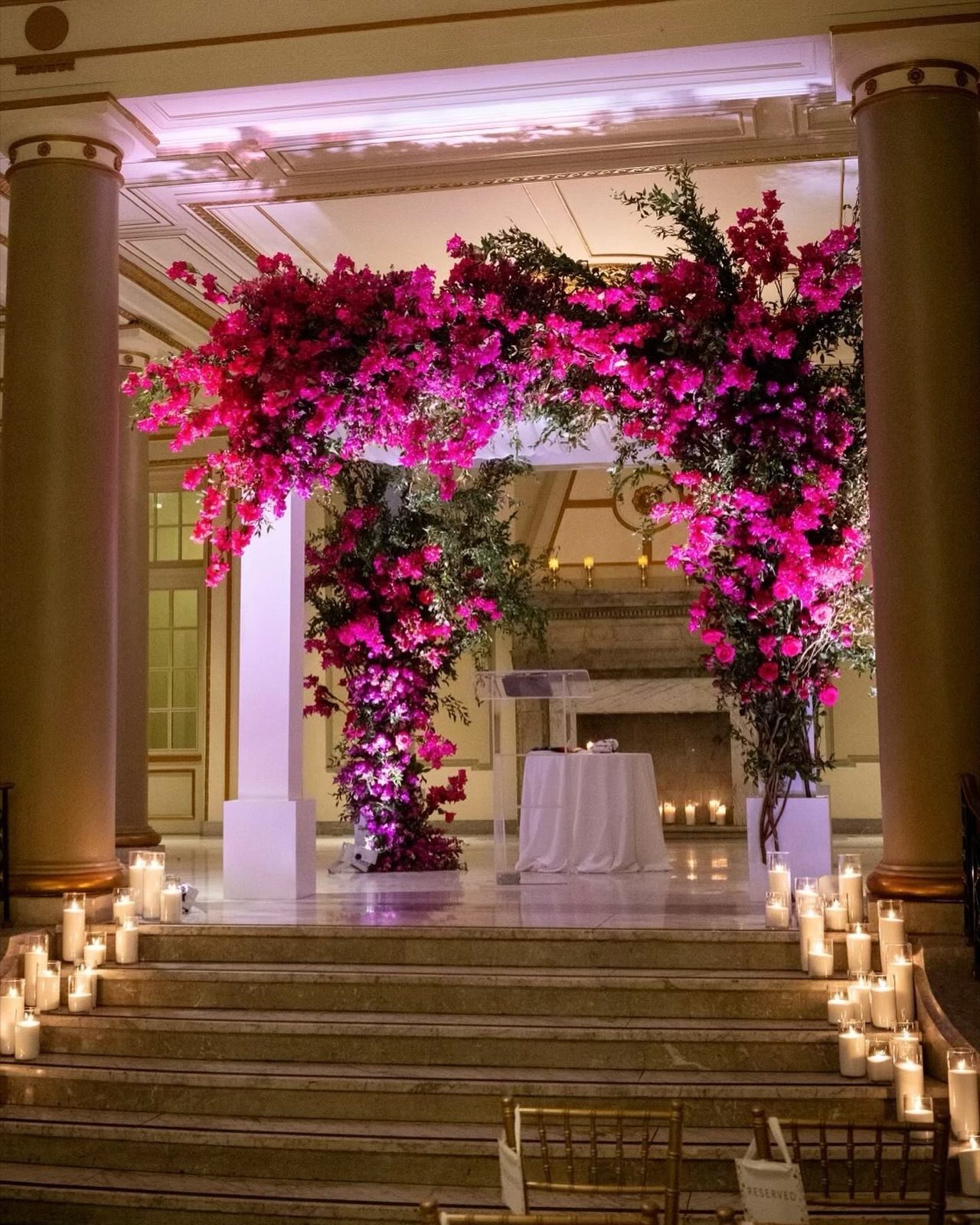 Bougainvillea ceremony arch with candles