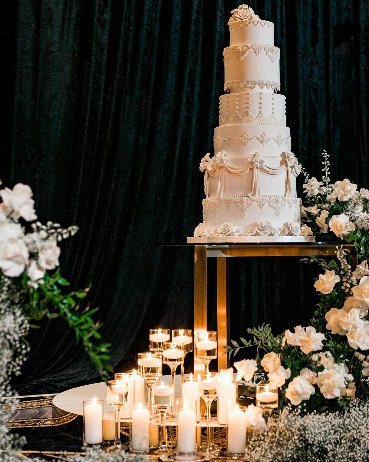 Wedding cake against dark velvet