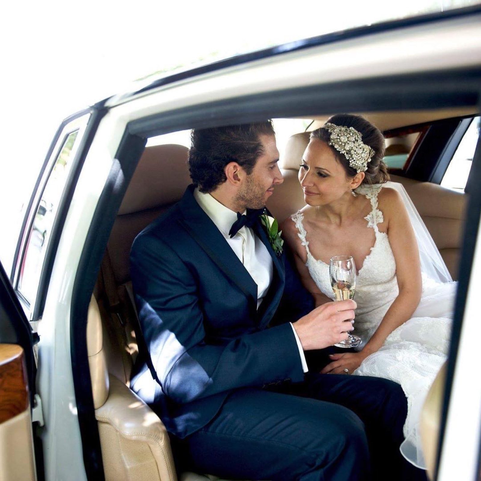 Newlyweds in a vintage car
